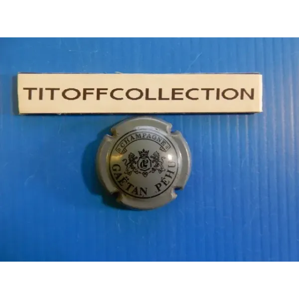 1 capsule de champagne  péhu gaétan gris et noir  ( no 4 )