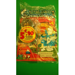 La Figurine Schtroumpf pompier + la base du puits et l'armature et le seau