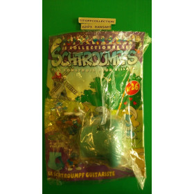 La Figurine Schtroumpf guitariste + socle d'une maison