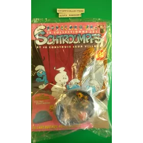 La Figurine Schtroumpf  aux cadeaux + le toit d'une maison